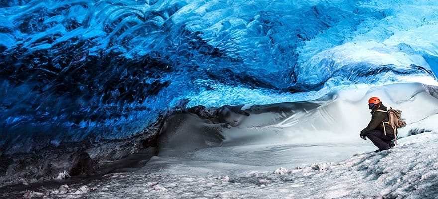 Traveller Visiting Ice Cave With Amazing Eye-catching Scenes